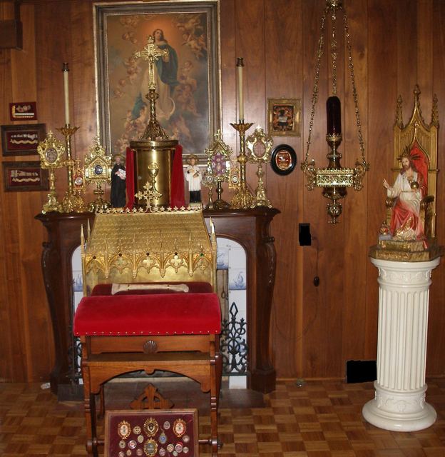 Family oratory with carved altar, gold tabernacle, and Murillo Immaculate Conception print