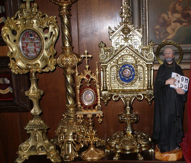 Statue of St. Ignatius beside French gilt bronze reliquaries